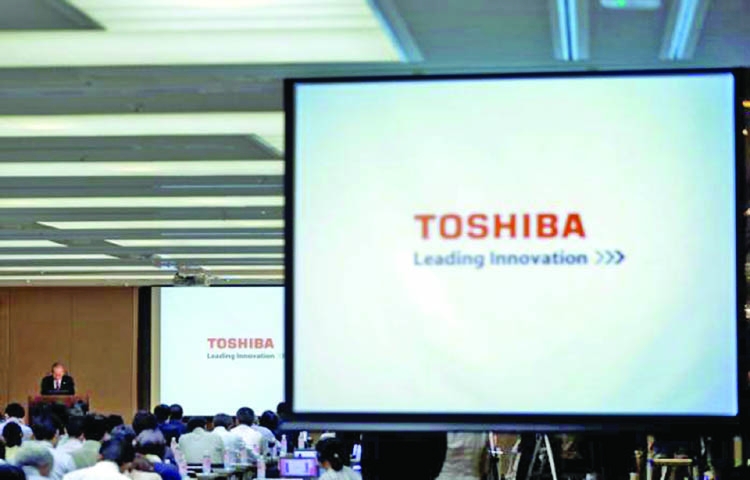 Toshiba stock listing status downgraded