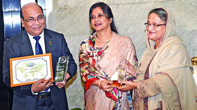 PM receives two awards won by Postal Dept