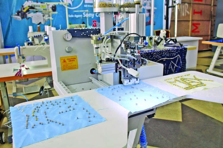 Visitors show interest to latest machinery for garment and textile