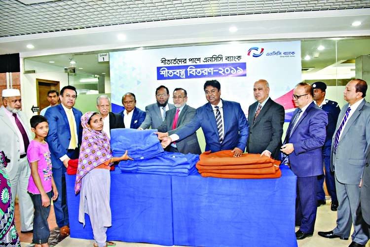 NCC Bank distributes blankets to cold stricken people