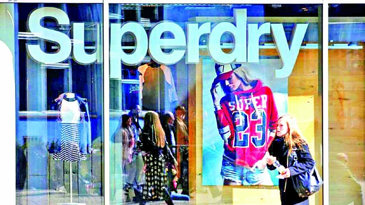 Superdry warns of long road to recovery as slashes store value