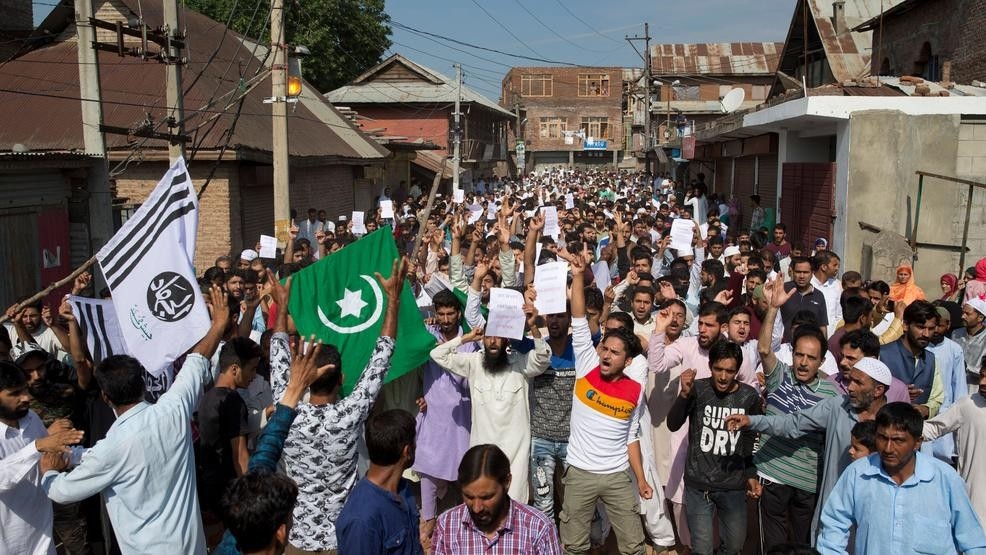 Troops let some Muslims go to mosques in locked-down Kashmir