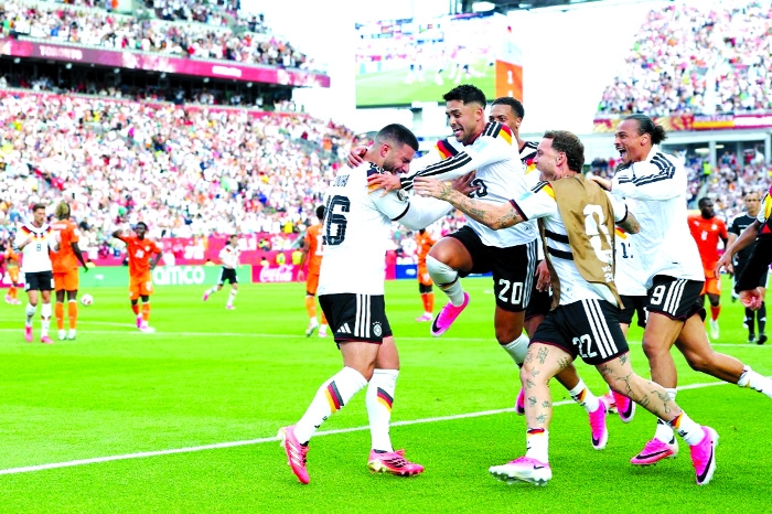 Germany into World Cup last 32 after late comeback