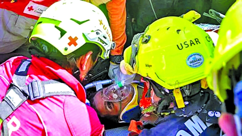 Venezuela quake survivor pulled out alive after eight days