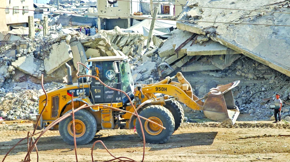 Gaza aid workers face delicate task of clearing ruins