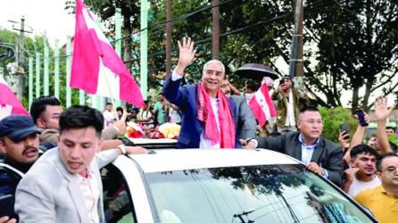Former Nepal PM Sher Bahadur returns home despite arrest warrant
