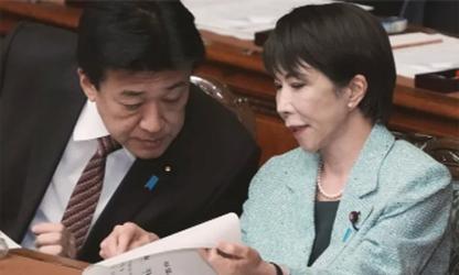 Japan govt approves record  budget, including for defence