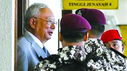 Former Malaysia PM found guilty in state funds scandal